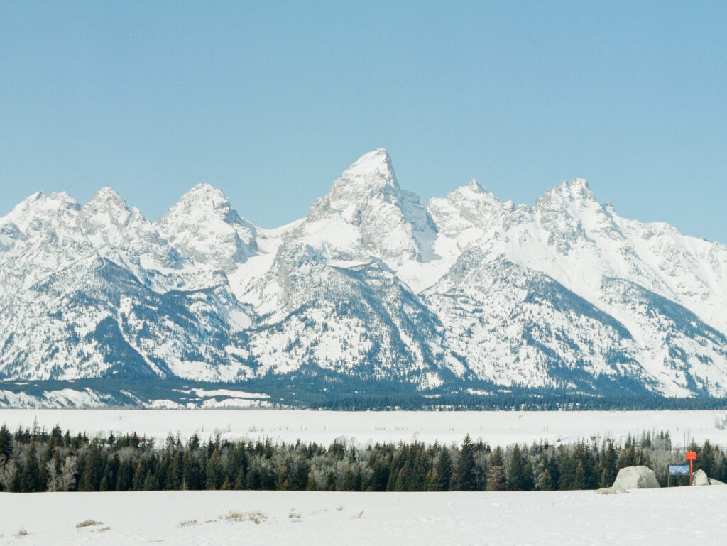 The Grand Teton Mountains covered in snow overlooking the best things to do in Jackson Hole