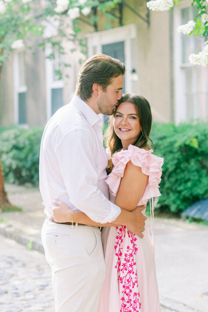 Man kisses fiancee's head in downtown Charleston