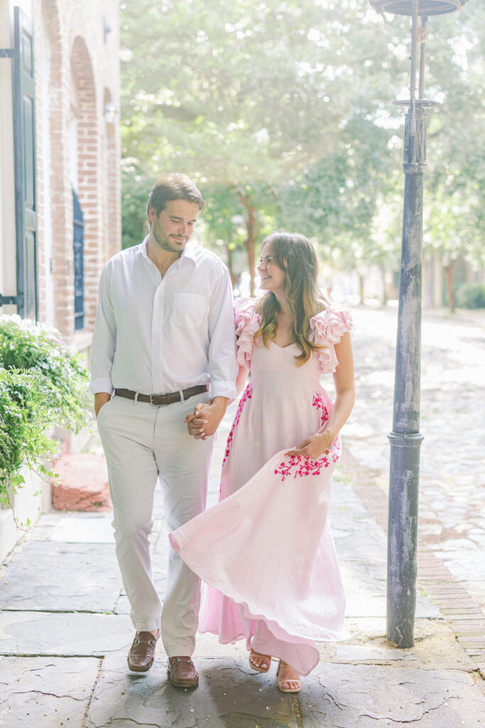 Charleston South Carolina walking couple in pink dress