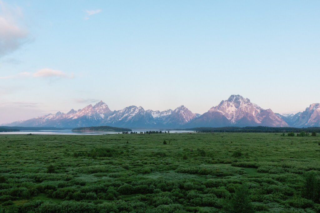 sunrise alpenglow on the grand teton mountain range